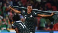 Nigeria's defender #14 Oluwatosin Demehin (R) celebrates with Nigeria's forward #11 Gift Monday after the end of the Australia and New Zealand 2023 Women's World Cup Group B football match between Ireland and Nigeria at Brisbane Stadium in Brisbane on July 31, 2023. (Photo by Patrick Hamilton / AFP)