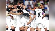 Al Sadd players celebrate during the match on Sunday.