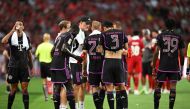 Bayern Munich's head coach Thomas Tuchel (C) speaks with his players during the Singapore Festival of Football pre-season friendly match against Liverpool in Singapore on August 2, 2023. (Photo by Mohd RASFAN / AFP)
