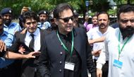 (Files) Pakistan's former Prime Minister Imran Khan (C) leaves after appearing in the Supreme Court in Islamabad on July 24, 2023. (Photo by Aamir Qureshi / AFP)