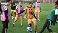 Jamaica's Kaylssa Van Zanten (C) and teammates take part in a training session in Melbourne on August 7, 2023, on the eve of the Women's World Cup football match between Colombia and Jamaica. Photo by William WEST / AFP