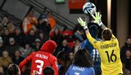 France's goalkeeper #16 Pauline Peyraud-Magnin (R) makes a save during the match between France and Morocco on August 8, 2023. (Photo by Brenton Edwards / AFP)
