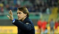(FILES) Italy's coach Roberto Mancini waves prior to the 2022 World Cup qualifying play-off football match between Italy and North Macedonia, on March 24, 2022 at the Renzo-Barbera stadium in Palermo. (Photo by Alberto PIZZOLI / AFP)
