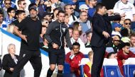 Fourth Official David Coote (C) stands betweeen Liverpool's German manager Jurgen Klopp (L) and Chelsea's Argentinian head coach Mauricio Pochettino during the English Premier League football match between Chelsea and Liverpool at Stamford Bridge in London on August 13, 2023. (Photo by HENRY NICHOLLS / AFP)
