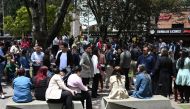 People remain on the streets after an eartquake in Bogota, on August 17, 2023.  (Photo by Raul ARBOLEDA / AFP)
