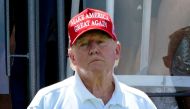 File: Former US President Donald Trump looks on during Round 3 at the LIV Golf-Bedminster 2023 at the Trump National in Bedminster, New Jersey, on August 13, 2023. (Photo by Timothy A Clary / AFP)
