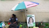 A street vendor displays a sign of Guatemalan candidate for the National Union of Hope party and former First Lady (2008–2011), Sandra Torres, before the closing of her campaign at the Terminal Market in Guatemala City, on August 18, 2023. (Photo by LUIS ACOSTA / AFP)
