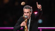 Spain's coach Jorge Vilda kisses the trophy after his team's victory in the Australia and New Zealand 2023 Women's World Cup final football match on August 20, 2023. (Photo by Franck Fife / AFP)