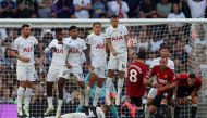 Manchester United's Portuguese midfielder #08 Bruno Fernandes takes a free kick during the English Premier League football match between Tottenham Hotspur and Manchester United at Tottenham Hotspur Stadium in London, on August 19, 2023. (Photo by Adrian DENNIS / AFP)