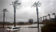 A car is partially submerged in floodwaters as Tropical Storm Hilary moves through the area on August 20, 2023 in Cathedral City, California. Photo by MARIO TAMA / GETTY IMAGES NORTH AMERICA / Getty Images via AFP