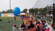 Performer Spandy Andy entertains families of evacuees from the Northwest Territories at the REMAX Field in Edmonton, Alberta, Canada, on August 21, 2023. (Photo by Andrej Ivanov / AFP)