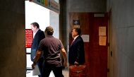 John Esposito (R) and Brian Tevis (L), lawyers of Rudy Giuliani, former attorney to former US President Donald Trump, leave the District Attorney's Office at the Fulton County Government Center in Atlanta, Georgia, on August 23, 2023. (Photo by CHANDAN KHANNA / AFP)
