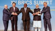 (From left) President of Brazil Luiz Inacio Lula da Silva, President of China Xi Jinping, South African President Cyril Ramaphosa, Prime Minister of India Narendra Modi and Russia's Foreign Minister Sergei Lavrov pose for a BRICS family photo during the 2023 BRICS Summit at the Sandton Convention Centre in Johannesburg on August 23, 2023. (Photo by Gianluigi Guercia / POOL / AFP)