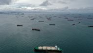 Aerial view of cargo ships waiting at the entrance of the Panama Canal at Panama Bay off Panama City, on Aug 23, 2023. (Photo by Luis Acosta / AFP)