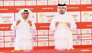Officials pick Qatar SC during the draw ceremony.