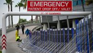 Workers set up a fence to prevent flooding at Tampa General Hospital in Tampa, Florida, on August 29, 2023 as the city prepares for Hurricane Idalia. Photo by Miguel J. Rodriguez Carrillo / Miguel J. Rodriguez Carrillo / AFP