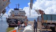File Photo: Labourers unload rice bags from a supply truck at India's main rice port at Kakinada Anchorage in the southern state of Andhra Pradesh, India, on September 2, 2021. (Rajendra Jadhav/Reuters)

