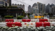Sand bags are placed to stop flooding by the waterfront at Tseung Kwan O in Hong Kong on September 1, 2023, ahead of the expected arrival of Super Typhoon Saola. Photo by ISAAC LAWRENCE / AFP
