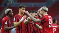 Al Rayyan's Roger Guedes (right) celebrates with teammates after scoring his second goal on Saturday.
