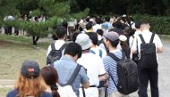 People wait in line for tickets to attend the first trial of Shinji Aoba, the defendant in the Kyoto Animation arson murder case, in Kyoto on September 5, 2023. Photo by JIJI Press / AFP
