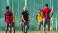 Qatar U-23 coach Ilidio Vale with players during a training session in Changwon, yesterday. 
