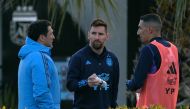 Argentina's forward Lionel Messi (C) and forward Angel Di Maria (R) chat during a training session in Ezeiza, Buenos Aires, on August 5, 2023. (Photo by Juan-Mabromata / AFP)