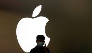 File photo: A man talks on a phone in front of an Apple logo outside its store in Shanghai, China, November 7, 2022. (REUTERS/Aly Song)

