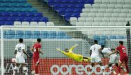 Qatar goalkeeper Meshaal Barsham concedes a goal against Kenya yesterday. AFP