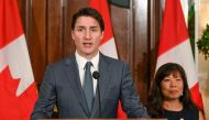 Canada's Prime Minister Justin Trudeau speaks next to his International Trade Minister Mary Ng at a press conference during a stopover visit to Singapore on September 8, 2023. (Photo by Roslan Rahman / AFP)