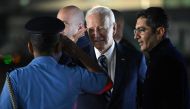 US President Joe Biden is greeted upon his arrival at the airport on the eve of the two-day G20 summit in New Delhi on September 8, 2023. (Photo by Saul Loeb / AFP)


