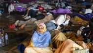 Residents take shelter ouside at a square following an earthquake in Marrakesh on September 9, 2023. (Photo by Fadel Senna / AFP)