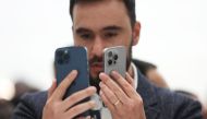An attendee looks at the brand new Apple iPhone 15 Pro and iPhone 15 Pro Max products during an Apple event on September 12, 2023 in Cupertino, California. Photo by JUSTIN SULLIVAN / GETTY IMAGES NORTH AMERICA / Getty Images via AFP