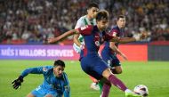 Barcelona's Portuguese forward #14 Joao Felix kicks the ball and scores his team's first goal during the Spanish Liga football match between FC Barcelona and Real Betis at the Estadi Olimpic Lluis Companys in Barcelona on September 16, 2023. (Photo by Josep LAGO / AFP)