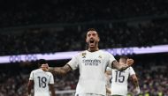 Real Madrid's Spanish forward #14 Joselu celebrates scoring his team's second goal during the Spanish Liga football match betweem Real Madrid and Real Sociedad at at the Santiago Bernabeu stadium in Madrid on September 17, 2023. (Photo by Pierre-Philippe MARCOU / AFP)