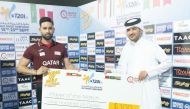 Himanshu Rathod receives man-of-the-match award from Qatar Cricket Association Secretary-General Khalid Saleh Al Rumaihi.