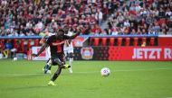 Bayer Leverkusen's Nigerian forward #22 Victor Boniface kicks the ball to score the 3-1 goal via penalty during the German first division Bundesliga football match between Bayer Leverkusen and FC Heidenheim in Leverkusen, western Germany, on September 24, 2023. (Photo by INA FASSBENDER / AFP)