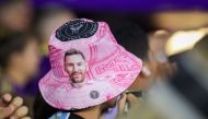 A fan wears a Lionel Messi bucket hat against during the game between the Inter Miami CF and the Orlando City SC during the second half at Exploria Stadium on September 24, 2023 in Orlando, Florida. (Photo by Alex Menendez / GETTY IMAGES NORTH AMERICA / Getty Images via AFP)
