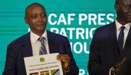 Patrice Motsepe, president of the Confederation of African Football (CAF), announces the host countries for the 2027 Africa Cup of Nations during a ceremony held in Cairo on September 27, 2023. (Photo by Khaled Desouki / AFP)
