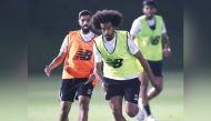 Al Sadd's Akram Afif (right) and Hassan Al Haydos in action during a training sessioan, yesterday.