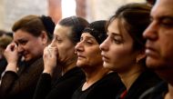 Mourners attend a mass for the victims of the wedding hall fire at a church in Qaraqosh, also known as Hamdaniyah, on September 28, 2023. (Photo by Zaid Al-Obeidi / AFP)