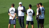 Real Madrid's Italian coach Carlo Ancelotti (2nd left) chats with his staff during a training session at Valdebebas Sport City in Madrid on October 6, 2023. (Photo by PIERRE-PHILIPPE MARCOU / AFP)