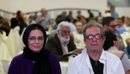 (FILES) Iranian film director Dariush Mehrjui and his wife Vahida Mohammadifar attend a ceremony in Tehran on July 1, 2015. (Photo by Abdulwahed MIRZAZADEH / isna news / AFP)
