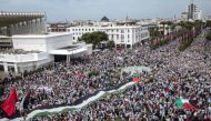 Demonstrators march in Rabat to express support to Palestinians in October 15, 2023. (Photo by Fadel Senna / AFP)