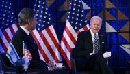 US Secretary of State Antony Blinken (L) sits with US President Joe Biden in Tel Aviv on October 18, 2023. (Photo by Brendan Smialowski / AFP)