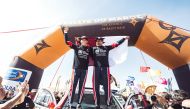Nasser Al Attiyah and his co-driver Mathieu Baumel celebrate their second successive World Rally Raid Championship (W2RC) title at the finish line of Rallye du Maroc, yesterday. 
