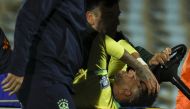 Brazil's forward Neymar leaves the field crying in pain after an injury on October 17, 2023. (Photo by Pablo PORCIUNCULA / AFP)