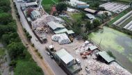 This aerial picture taken on October 19, 2023 shows garbage at the PULI Township Sanitation Department office building in Nantou County. (Photo by Sean Chang / AFP)