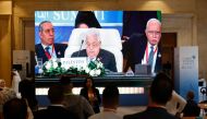 Seen on a large screen the Palestinian president Mahmud Abbas attends the International Peace Summit hosted by the Egyptian president in Cairo on October 21, 2023. (Photo by Khaled Desouki / AFP)