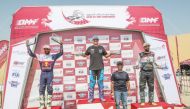 Michael Anderson (centre), Mohammed Al Balooshi (left) and Sultan Al Balooshi (right) celebrate on the podium. 