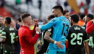 Girona's Argentinian goalkeeper #13 Paulo Gazzaniga (R) and teammates celebrate at the end of the Spanish league football match between Rayo Vallecano de Madrid and Girona FC at the Vallecas stadium in Madrid on November 11, 2023. Girona won 1-2. (Photo by OSCAR DEL POZO / AFP)